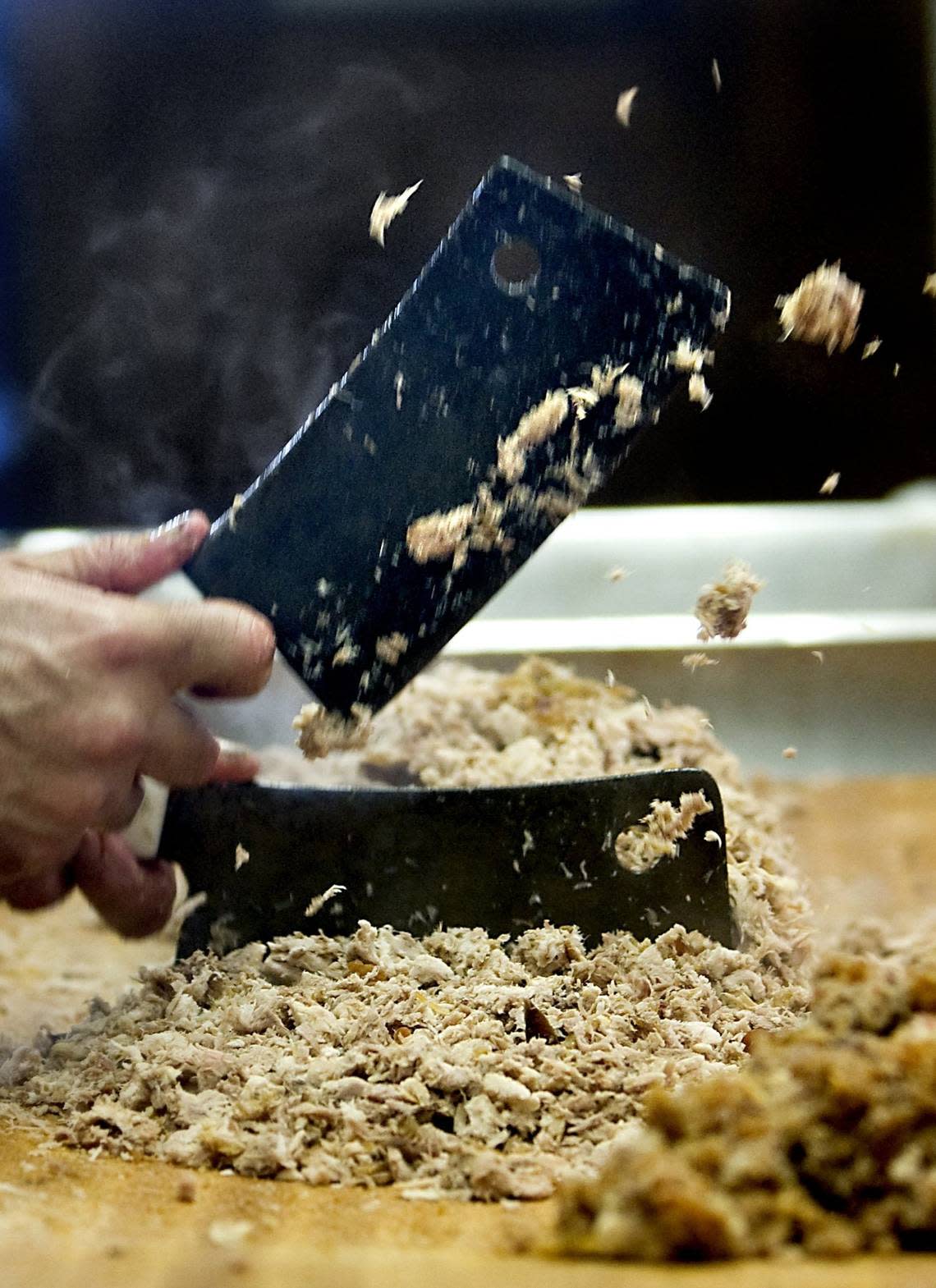 Two cleavers are used to chop barbecue at The Skylight Inn.