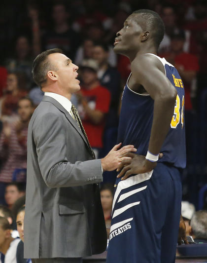 UC Irvine coach Russell Turner, left, talks to center Mamadou Ndiaye (AP Photo/Rick Scuteri)