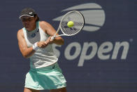 Iga Swiatek, of Poland, returns a shot to Sloane Stephens, of the United States, during the second round of the U.S. Open tennis championships, Thursday, Sept. 1, 2022, in New York. (AP Photo/Mary Altaffer)