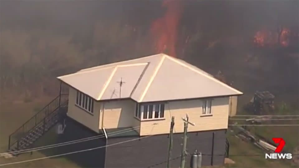 This house looked in trouble for when the blaze took hold of surrounding yards. Source: 7 News