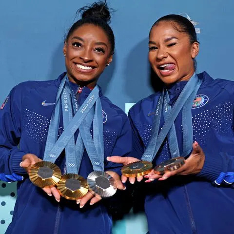 <p>Jamie Squire/Getty</p> Simone Biles and Jordan Chiles