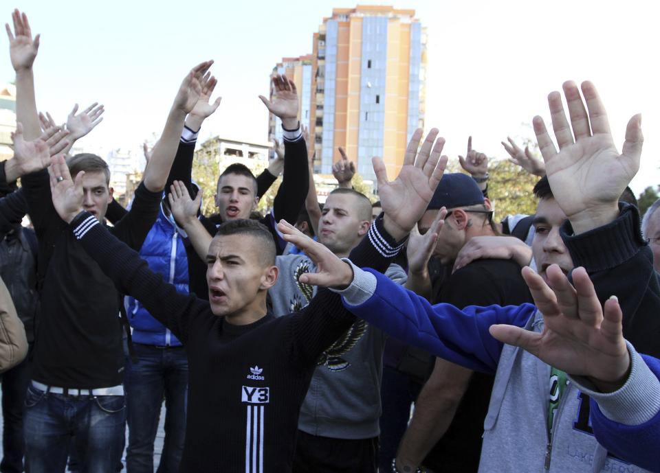 Demonstrators protest against the potential dismantling of Syrian chemical weapons in Albania in front of the Parliament in Tirana