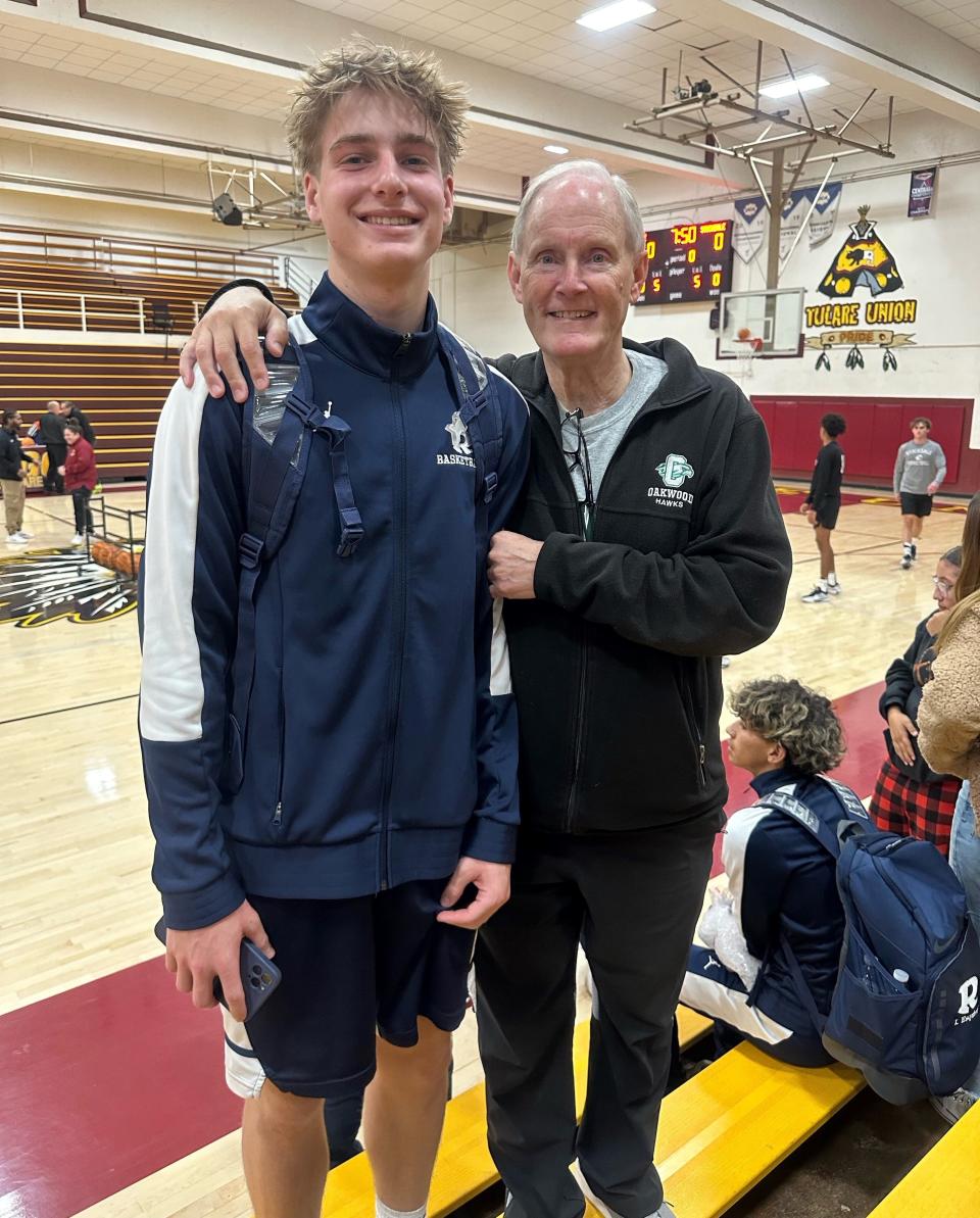 Redwood High School basketball player Zander Jensen poses for a picture with his grandpa, Cort, in a game earlier this season. Zander is the son of College of the Sequoias' men's basketball coach Dallas Jensen.
