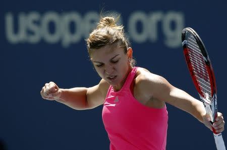 Simona Halep of Romania celebrates a point over Danielle Rose Collins of the U.S. during their match at the 2014 U.S. Open tennis tournament in New York, August 25, 2014. REUTERS/Mike Segar