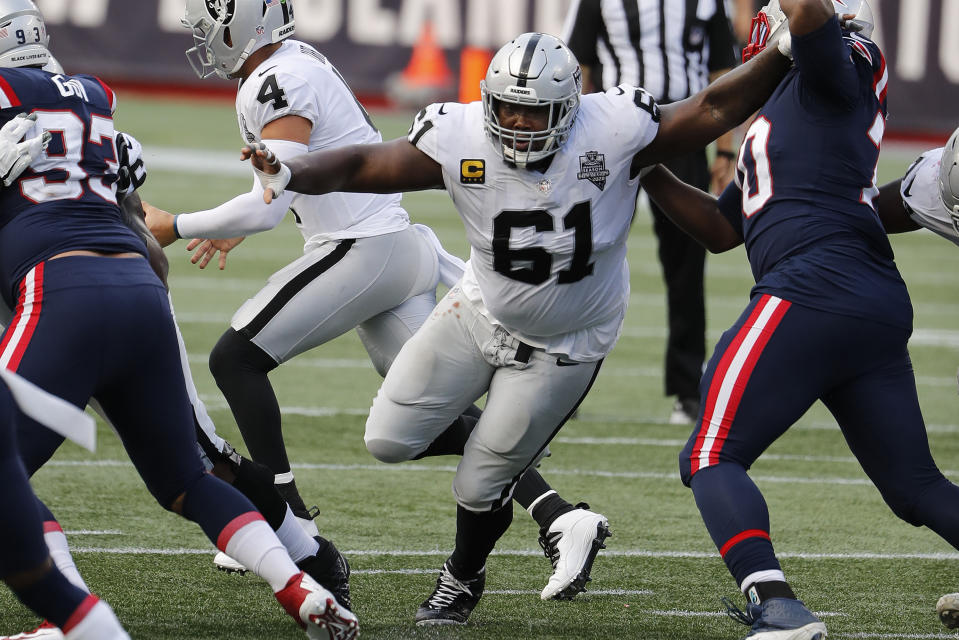 FILE - Las Vegas Raiders center Rodney Hudson blocks against the New England Patriots during an NFL football game at Gillette Stadium in Foxborough, Mass., in this Sunday, Sept. 27, 2020, file photo. The Las Vegas Raiders are planning to release star center Rodney Hudson as part of a major overhaul of the team's offensive line. A person familiar with the move said Tuesday, March 16, 2021, that Hudson will be released with two years left on his current contract. The person spoke on condition of anonymity because the move hadn't been announced. NFL Network first reported the move.(AP Photo/Winslow Townson, File)