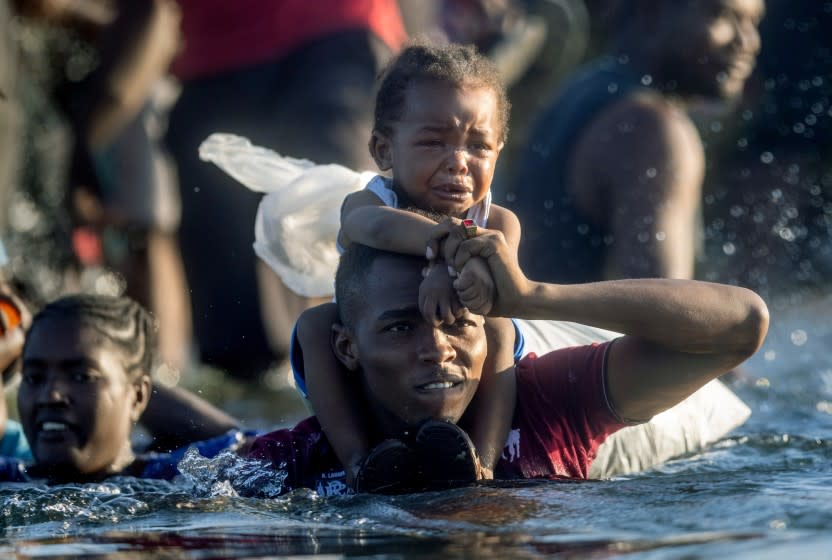 CIUDAD ACUNA, MEXICO - SEPTEMBER 20: Haitian immigrants cross the Rio Grande back into Mexico from Del Rio, Texas on September 20, 2021 to Ciudad Acuna, Mexico. As U.S. immigration authorities began deporting immigrants back to Haiti from Del Rio, thousands more waited in a camp under an international bridge in Del Rio while others crossed the river back into Mexico to avoid deportation. (Photo by John Moore/Getty Images)