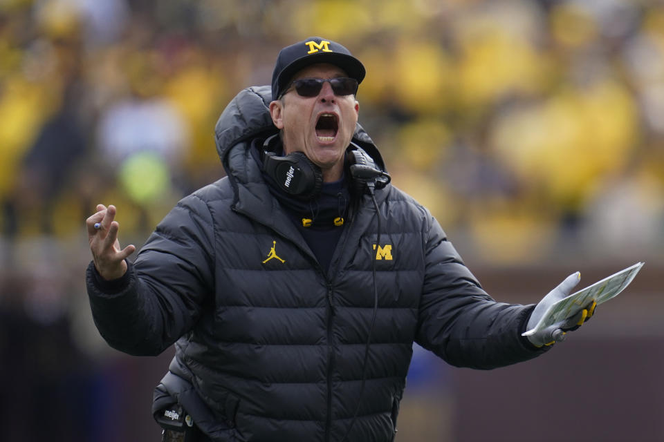 Michigan head coach Jim Harbaugh argues a call against Penn State in the second half of an NCAA college football game in Ann Arbor, Mich., Saturday, Oct. 15, 2022. (AP Photo/Paul Sancya)