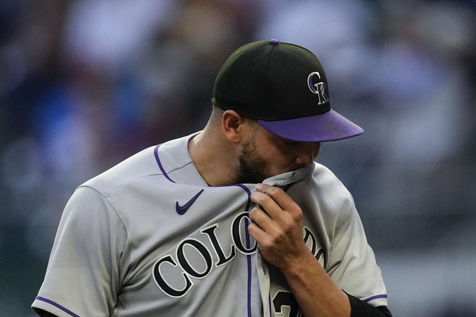 Colorado Rockies starting pitcher Dinelson Lamet walks to the dugout after getting the last out in the fourth inning of a baseball game against the Atlanta Braves, Friday, June 16, 2023, in Atlanta. (AP Photo/John Bazemore)