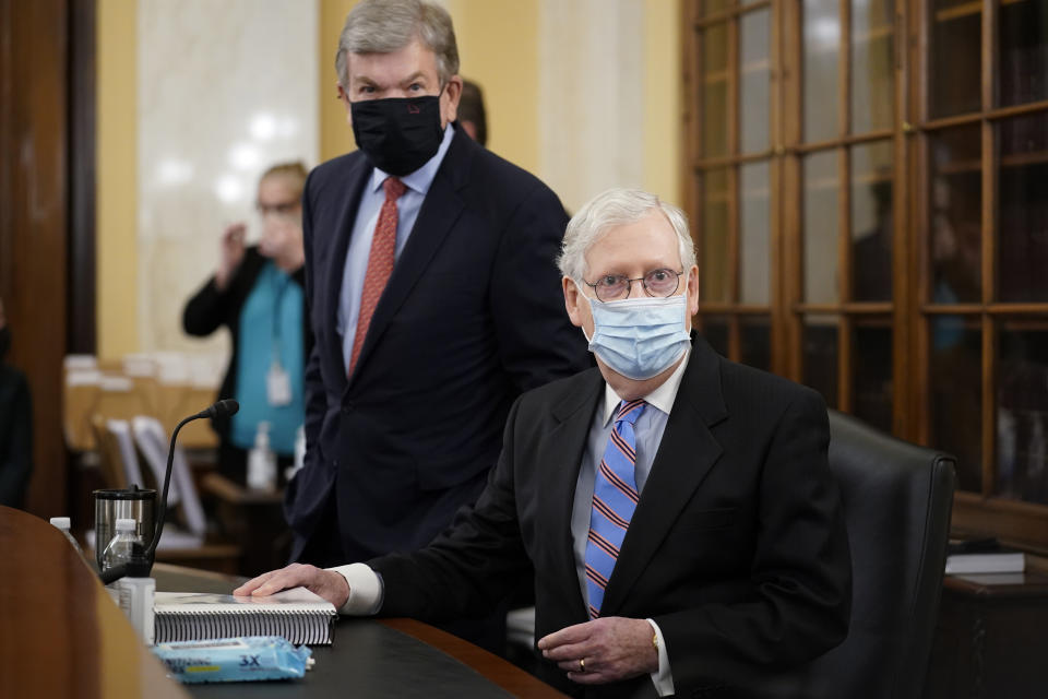 Senate Minority Leader Mitch McConnell of Ky., right, and Sen. Roy Blunt, R-Mo., prepare for a Senate Rules Committee hearing at the Capitol in Washington, Tuesday, May 11, 2021. (AP Photo/J. Scott Applewhite)