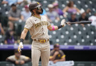 San Diego Padres' Fernando Tatis Jr. drops his bat after hitting a solo home run in the third inning of a baseball game Wednesday, June 16, 2021, in Denver. (AP Photo/David Zalubowski)