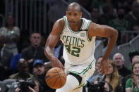 Boston Celtics center Al Horford (42) dribbles downcourt during the second half of Game 4 of the NBA basketball playoffs Eastern Conference finals against the Miami Heat, Monday, May 23, 2022, in Boston. (AP Photo/Charles Krupa)
