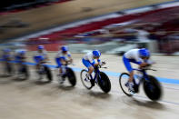 Members of the Italian women's track cycling team round the track during a training session inside the Izu velodrome at the 2020 Summer Olympics, Thursday, July 29, 2021, in Tokyo, Japan. (AP Photo/Christophe Ena)