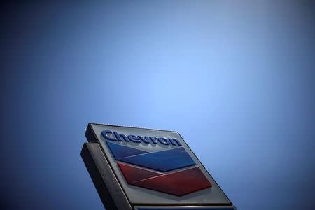 FILE PHOTO - The logo of Chevron (CVX) is seen in Los Angeles, California, United States, April 12, 2016. REUTERS/Lucy Nicholson/File Photo