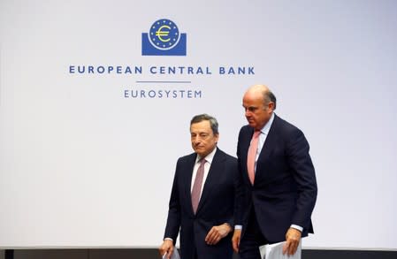 FILE PHOTO: European Central Bank President Draghi and Vice-President de Guindos leave a news conference at the ECB headquarters in Frankfurt