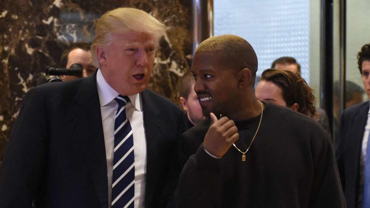 Singer Kanye West and President-elect Donald Trump leave the elevator after their meeting at Trump Tower on December 13, 2016 in New York. (Photo by TIMOTHY A. CLARY / AFP)