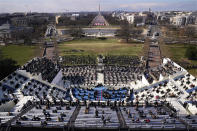 Guests and spectators attend the 59th Presidential Inauguration for President Joe Biden at the U.S. Capitol in Washington, Wednesday, Jan. 20, 2021. (AP Photo/Susan Walsh, Pool)