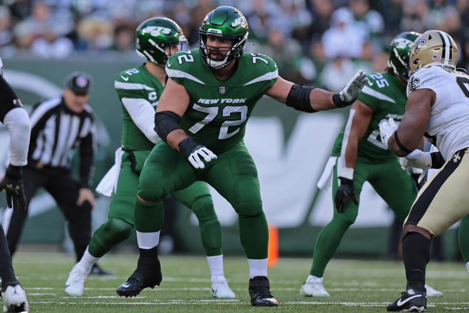 FILE - New York Jets guard Laurent Duvernay-Tardif (72) blocks during an NFL football game against the New Orleans Saints, Sunday, Dec. 12, 2021, in East Rutherford, N.J. Duvernay-Tardif signed with the Jets' practice squad Friday, Nov. 18, 2022, giving New York some depth on a unit hit hard by injuries this season. Duvernay-Tardif stepped away from football after spending the last two months of last season with the Jets so he could begin working on his medical residency program at a Montreal-area hospital. (AP Photo/Adam Hunger, File)