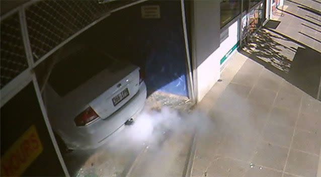 The moment the car breaks through the front entrance to the laundromat. Source: 7 News.