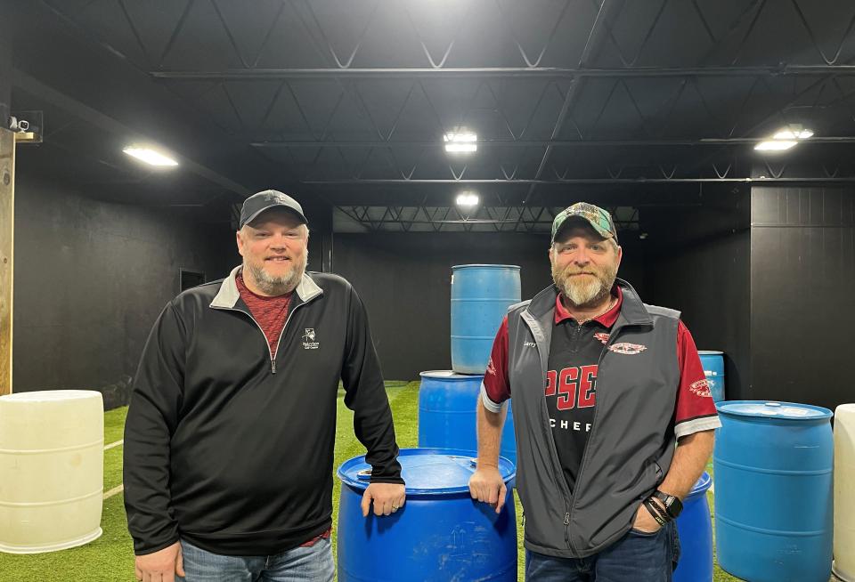 Forrest Hoffert (left) unveils the newest expansion to Lebanon Indoor Archery and Supplies. Feb. 24