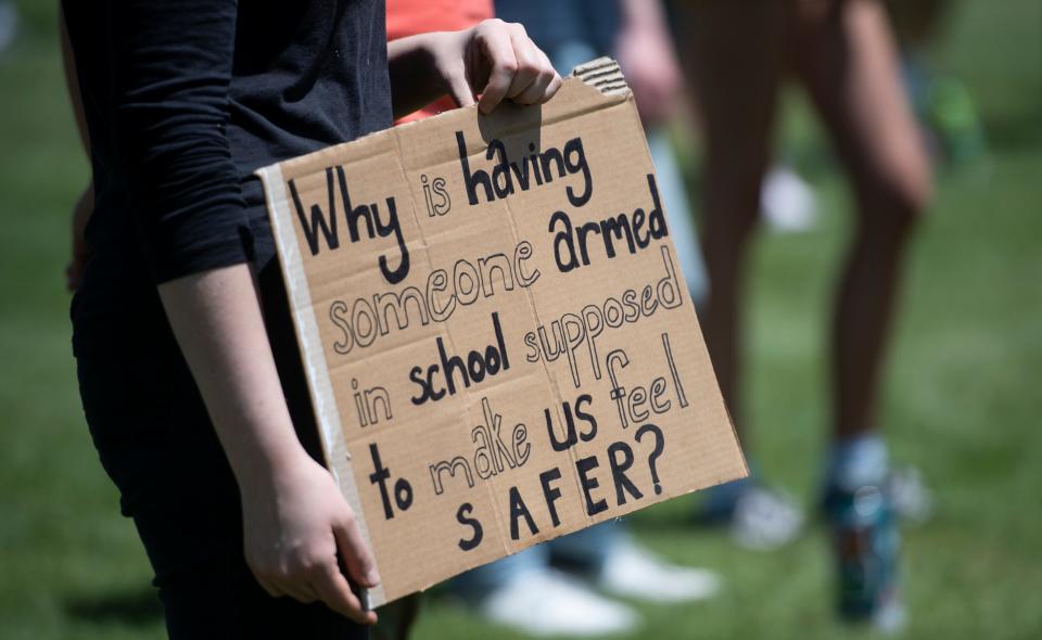 A student holds a sign during a protest outside the Poudre School District's Fort Collins headquarters calling for change in the school district amid the nation's conversation of race and social justice in the wake of George Floyd's death in Fort Collins, Colo. on Monday, June 8, 2020. 