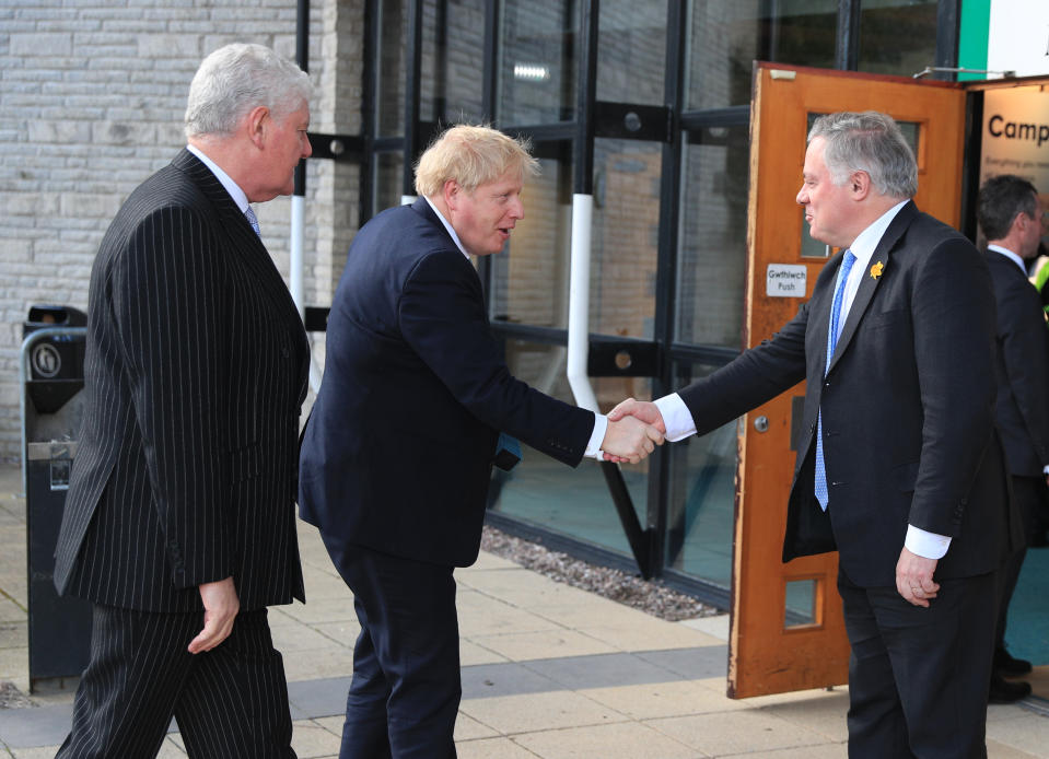 Byron Davies (left) with Prime Minister Boris Johnson shaking hands with Simon Baynes as he arrives at the Welsh Conservative Party Conference in the Llangollen Pavilion in north Wales. (Photo by Peter Byrne/PA Images via Getty Images)