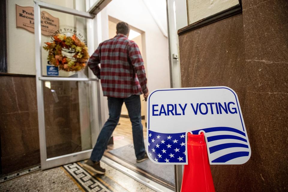 Voters head to the polls as early voting begins, Wednesday, Oct. 26, 2022, at the Cabell County Courthouse in Huntington, W.Va. (Sholten Singer/The Herald-Dispatch via AP) ORG XMIT: WVHUN307