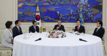 South Korean President Moon Jae-in, third from right, speaks during a meeting with ruling and opposition party leaders to talk about an ongoing South Korea-Japan trade conflict at the presidential Blue House in Seoul, South Korea, Thursday, July 18, 2019. (Bee Jae-man/Yonhap via AP)