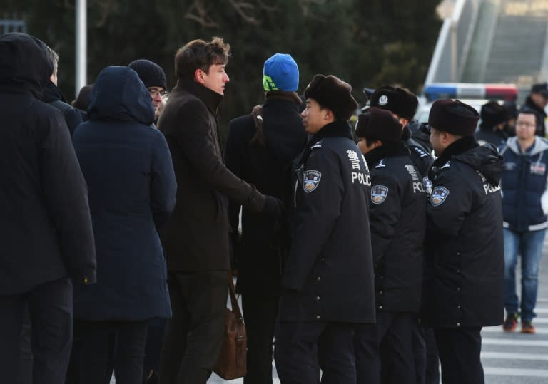 Diplomats and police wait outside the Beijing City High Court, where the result of an appeal by jailed Chinese journalist Gao Yu was being announced, on November 26, 2015