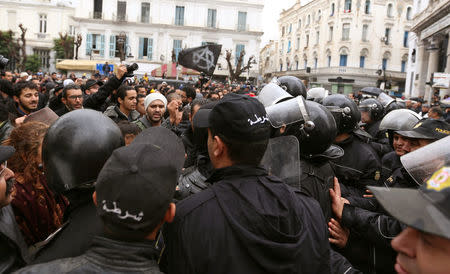 Tunisian protesters clash with riot police during demonstrations against rising prices and tax increases, in Tunis, Tunisia January 12, 2018. REUTERS/Zoubeir Souissi