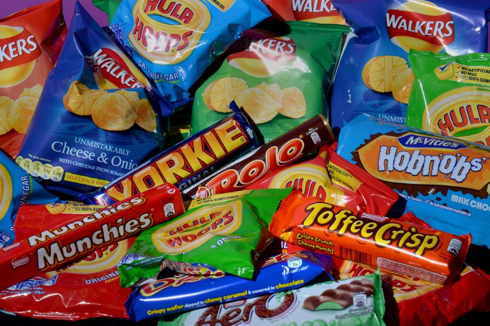 A collection of biscuits, crisps, chocolate bars and carbonated drinks (PA Archive)