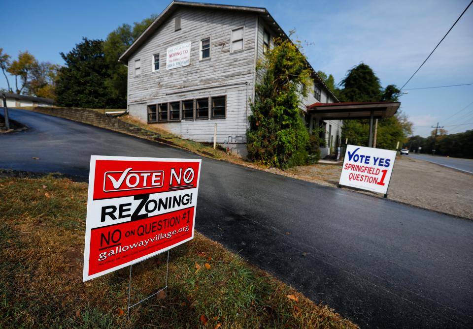 Signs along South Lone Pine Avenue in the Galloway Neighborhood, both for and against, Question 1 on Wednesday, Oct. 12, 2022. Question 1 takes a rezoning proposal for a mixed-use development across from Sequiota Park to voters on the November ballot. 