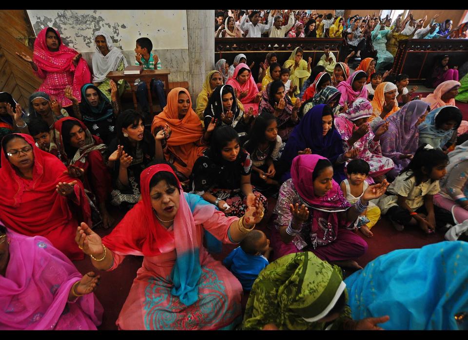 Pakistani Christians pray during an Easter Sunday Mass at a church in Lahore.&nbsp;