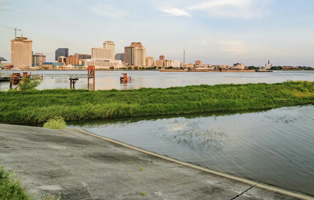 The Mississippi River approaches a levee at left in New Orleans, La., Thursday, July 11, 2019, ahead of Tropical Storm Barry. Never in the modern history of New Orleans has water from the Mississippi River overtopped the city’s levees. (AP Photo/Matthew Hinton)