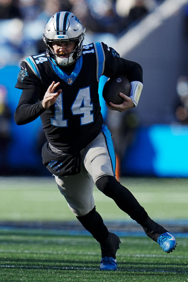 Charlotte, NC USA; Carolina Panthers quarterback Sam Darnold (14) runs in  for a touchdown during an NFL game against the Detroit Lions at Bank of  America Stadium, Saturday, December 24, 2022. The