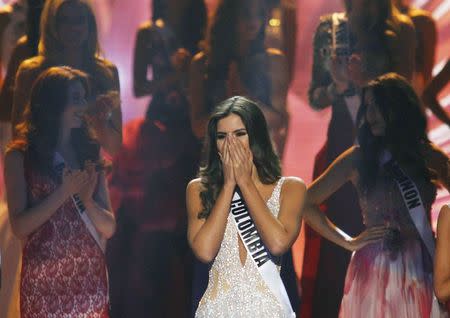 Miss Colombia Paulina Vega reacts just before being crowned the winner at the 63rd Annual Miss Universe Pageant in Miami, Florida, January 25, 2015. REUTERS/Andrew Innerarity