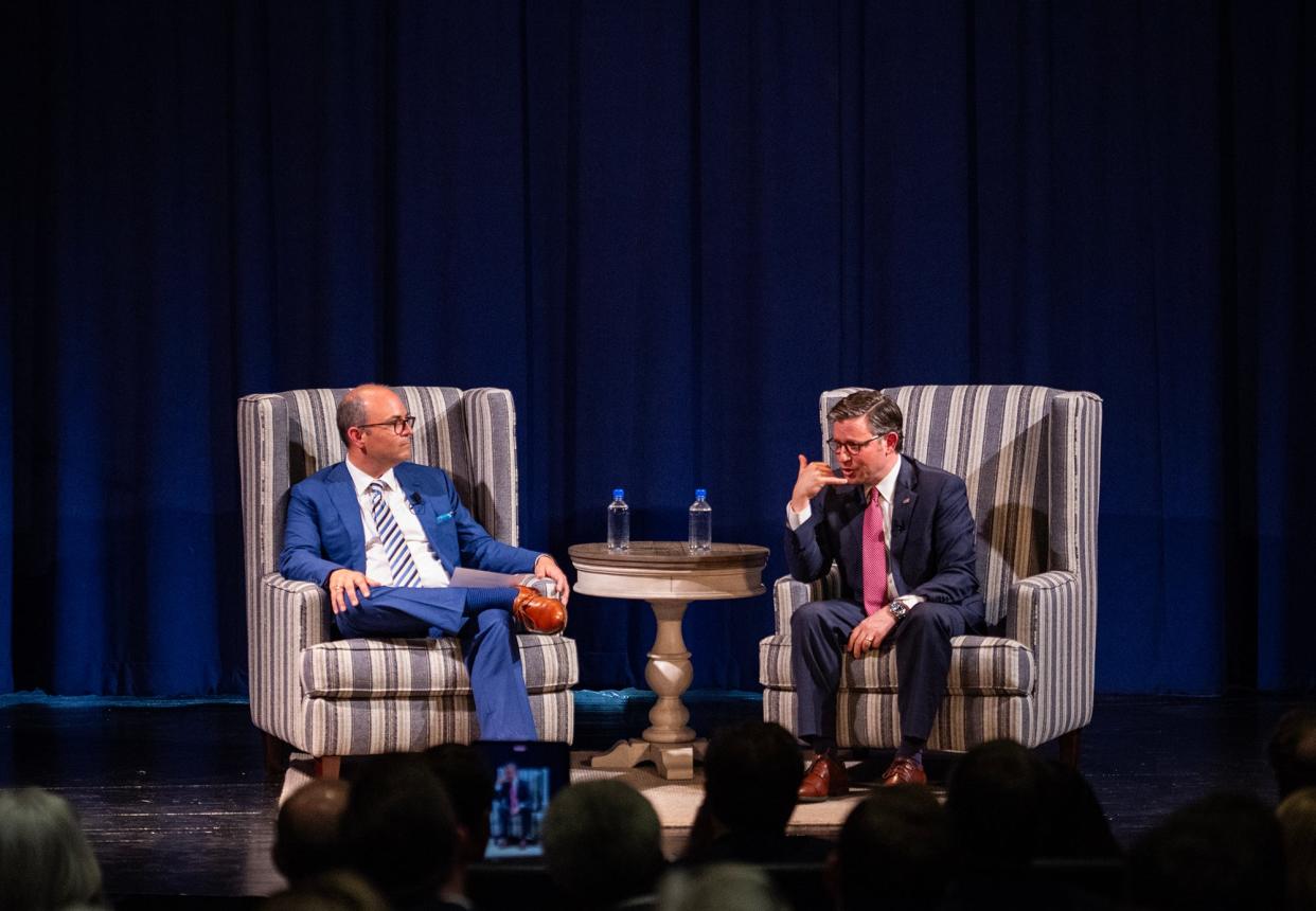 Speaker of the House Mike Johnson speaks to Ron Matis, executive director of National Apostolic Christian Leadership Conference, during the event hosted by the NACLC at Jackson Preparatory School in Flowood on Thursday.