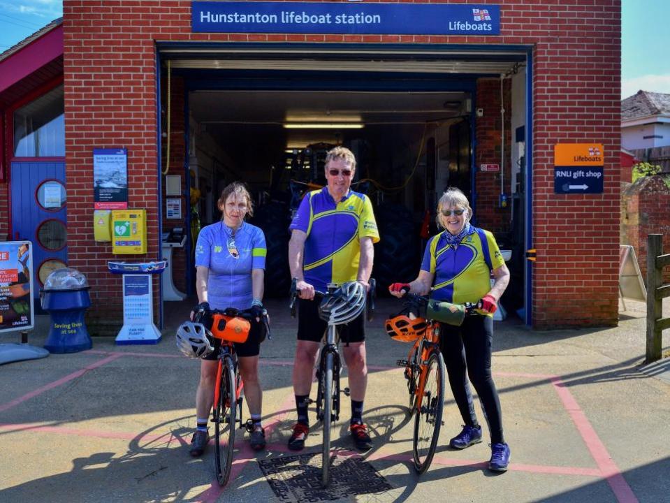 Eastern Daily Press: From left, cyclists Julie Wright, Malcolm Craven and Janet Craven at Hunstanton RNLI