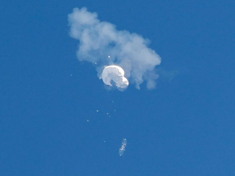 The suspected Chinese spy balloon drifts to the ocean after being shot down off the coast in Surfside Beach, South Carolina, U.S. February 4, 2023.