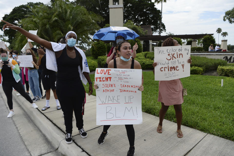 Protesters march June 8 in Boca Raton, Florida. (Photo: mpi04/MediaPunch /IPX via Associated Press)