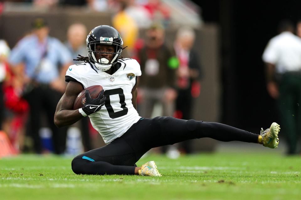 Dec 24, 2023; Tampa, Florida, USA; Jacksonville Jaguars wide receiver Calvin Ridley (0) is brought down in the back field against the Tampa Bay Buccaneers in the second quarter at Raymond James Stadium. Mandatory Credit: Nathan Ray Seebeck-USA TODAY Sports