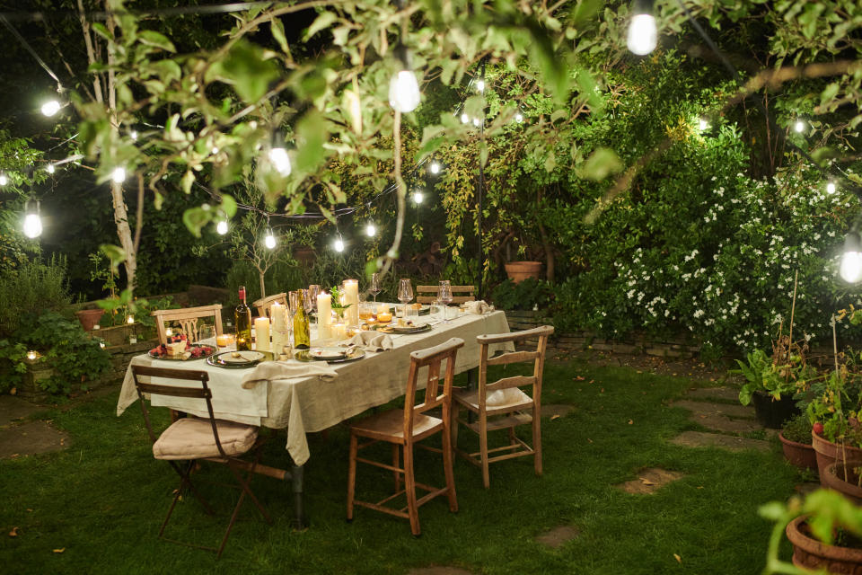 Dining table outside in a garden. Al fresco dining.