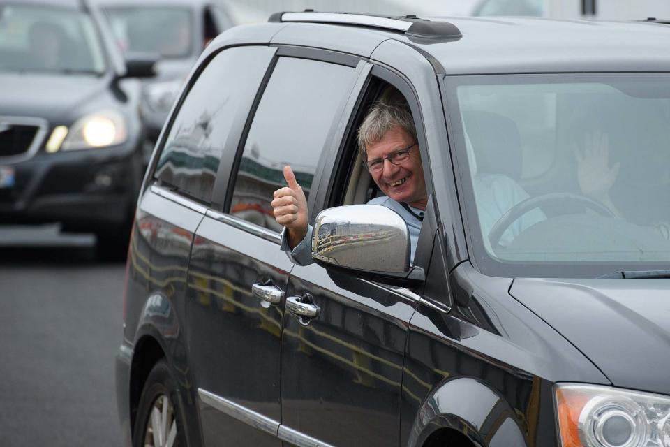 A driver gestures as vehicles disembark from a ferry in Portsmouth (Getty Images)