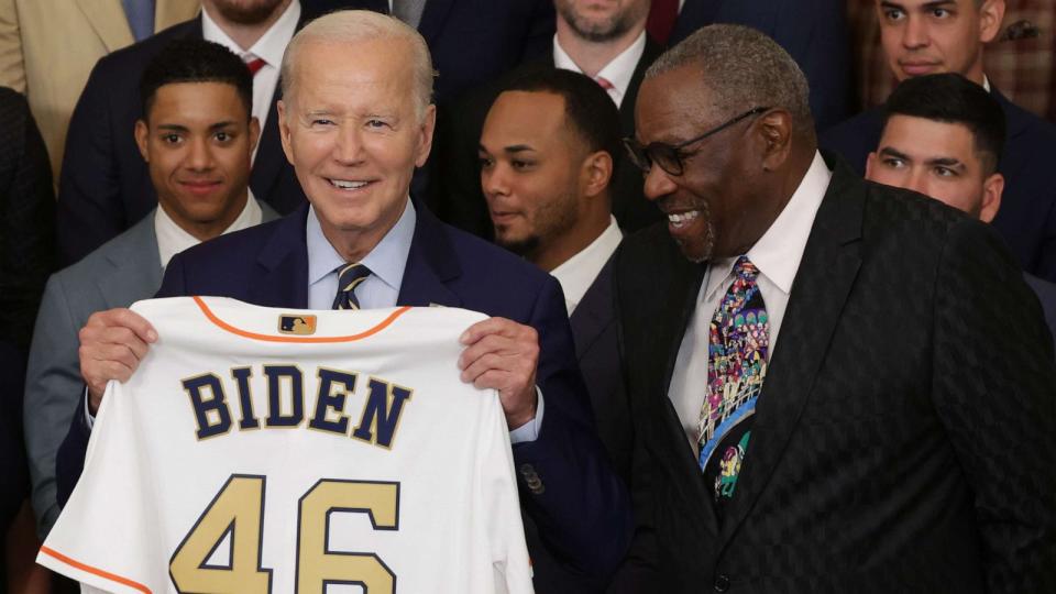 PHOTO: President Joe Biden holds up a jersey as team manager of the Houston Astros Dusty Baker looks on during an East Room event at the White House, Aug. 7, 2023 in Washington, DC. (Alex Wong/Getty Images)