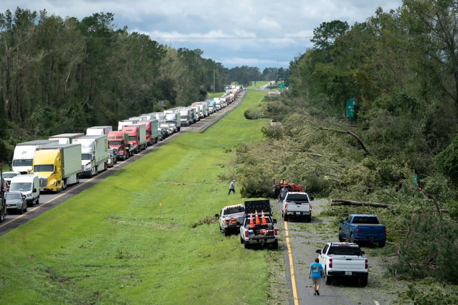 People work to clear I-10 of fallen trees after Hurricane Idalia crossed the state on August 30, 2023 near Madison, Florida. The storm made landfall at Keaton Beach, Florida as category 3 hurricane. (Photo by Sean Rayford/Getty Images)