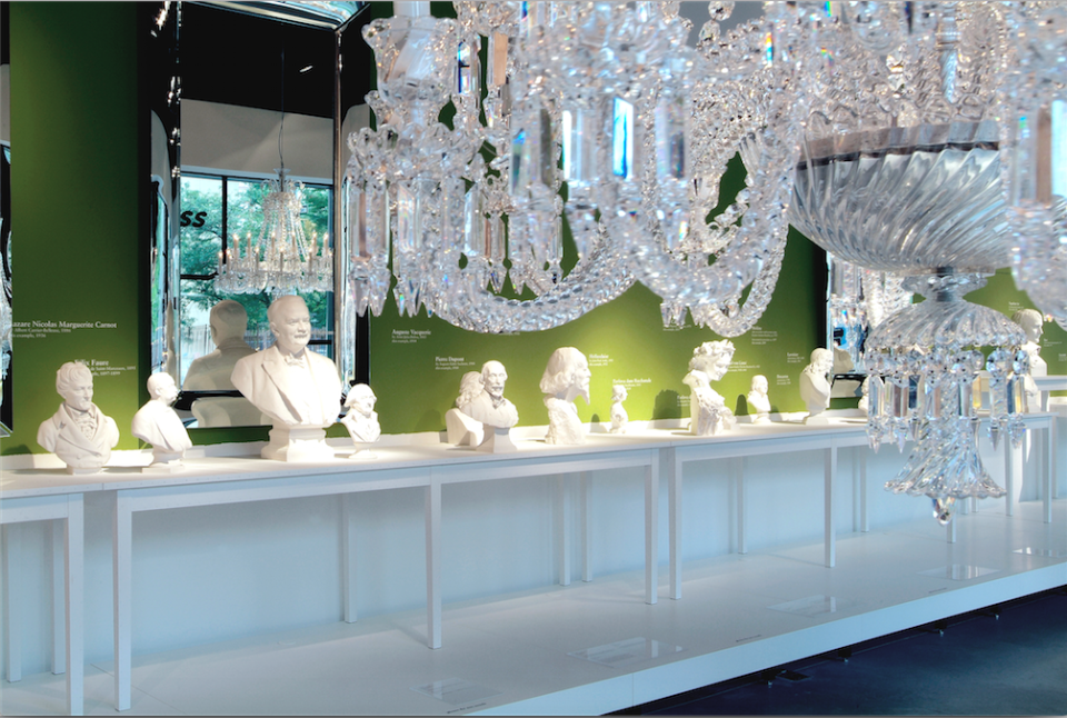 S`evres busts sat on tables designed by Ann Demeulemeester, below shimmering Baccarat chandeliers at MOSS.