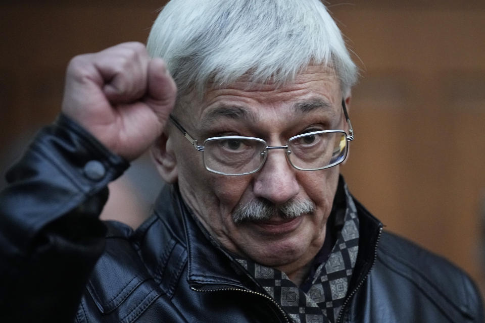 Oleg Orlov, a member of the Board of the International Historical Educational Charitable and Human Rights Society 'Memorial' (International Memorial) gestures after a court session in Moscow, Russia, Wednesday, Oct. 11, 2023. The court ordered Orlov, co-chair of the Nobel Peace Prize-winning human rights group Memorial, to pay a fine of nearly $1,500 on the charges of "discrediting" the Russian military in his criticism of Russia's campaign in Ukraine. (AP Photo/Alexander Zemlianichenko)