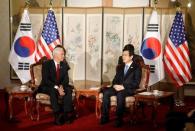 U.S. Vice President Mike Pence talks with acting South Korean President and Prime Minister Hwang Kyo-ahn during their meeting in Seoul, South Korea, April 17, 2017. REUTERS/Kim Hong-Ji