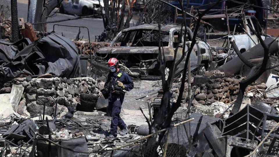 PHOTO: Search and rescue crews look through the remains of a neighborhood on Aug. 17, 2023 in Lahaina, Hawaii. (Justin Sullivan/Getty Images, FILE)