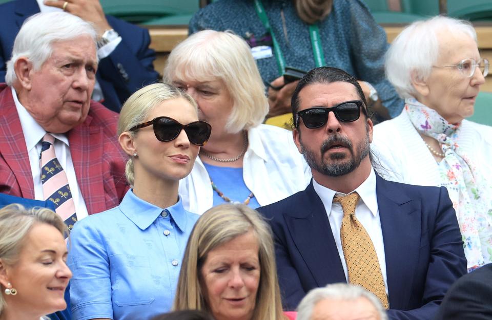 Foo Fighters frontman Dave Grohl and his wife Jordyn await the first serve on day two of the festivities.