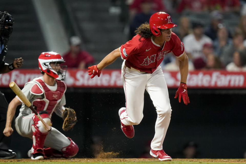 Los Angeles Angels designated hitter Cole Tucker hits a single to score Brandon Drury during the sixth inning of a baseball game against the Philadelphia Phillies, Monday, April 29, 2024, in Anaheim, Calif. (AP Photo/Ryan Sun)